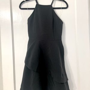 Halter neck crisscross back black dress with layered skirt